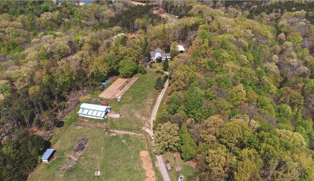 birds eye view of property with a wooded view