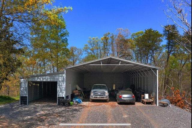 view of car parking featuring a carport and a detached garage