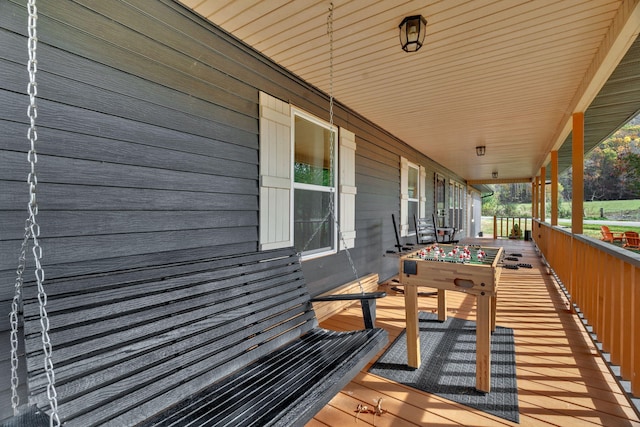 wooden deck featuring covered porch