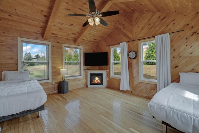 bedroom featuring wood walls and wooden ceiling