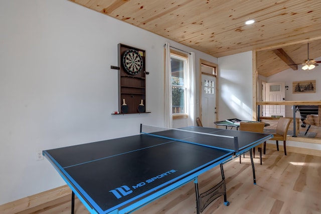 recreation room featuring vaulted ceiling with beams, ceiling fan, light wood-type flooring, and wooden ceiling