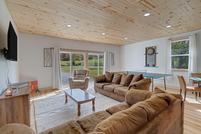 living room with light hardwood / wood-style floors and wooden ceiling