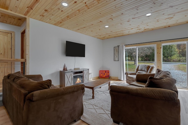 living room featuring light hardwood / wood-style flooring and wooden ceiling