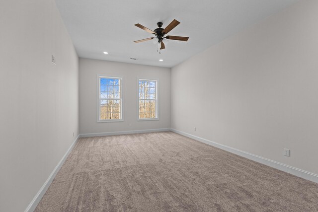 spare room featuring carpet floors, baseboards, ceiling fan, and recessed lighting