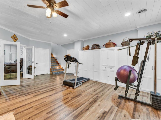 exercise area with ceiling fan, light hardwood / wood-style floors, wood ceiling, and ornamental molding