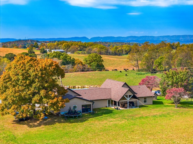 drone / aerial view featuring a mountain view and a rural view