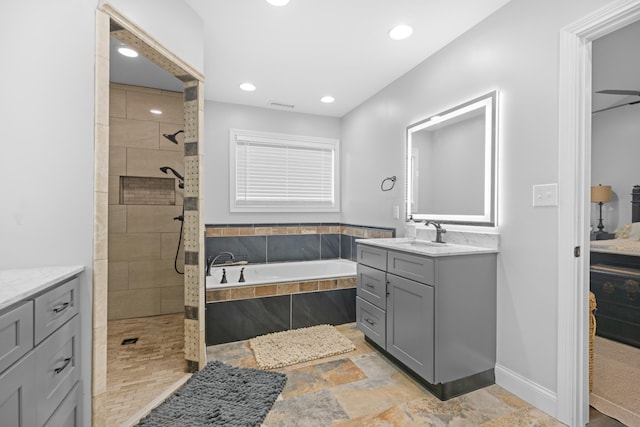 bathroom featuring vanity and separate shower and tub