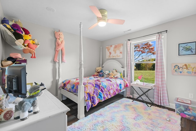 bedroom featuring ceiling fan and dark wood-type flooring