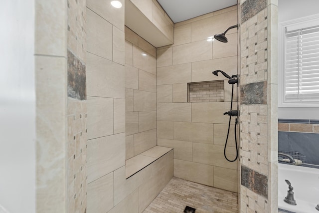 bathroom with a tile shower