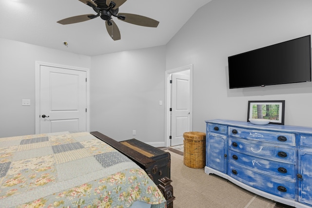 bedroom featuring ceiling fan, light colored carpet, and vaulted ceiling