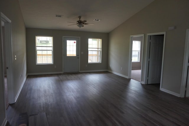 interior space with lofted ceiling, ceiling fan, and dark wood-type flooring