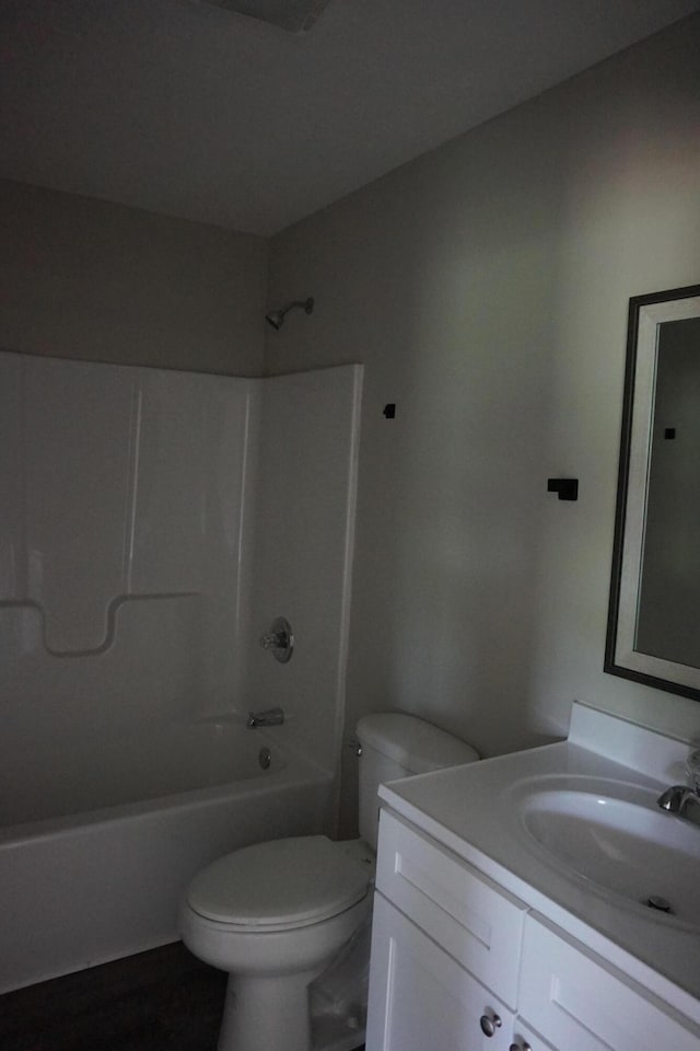 full bathroom with shower / tub combination, vanity, and toilet