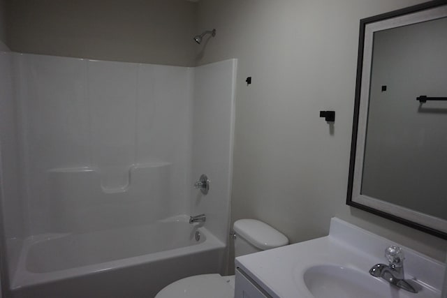 full bathroom featuring vanity, toilet, and washtub / shower combination