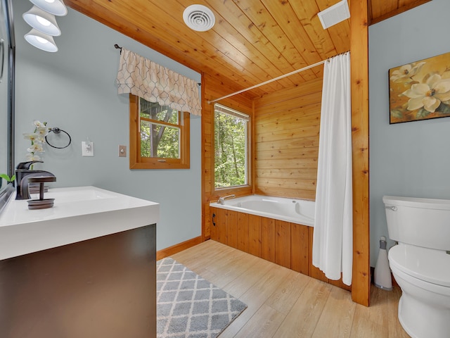 bathroom featuring toilet, wood finished floors, wood ceiling, baseboards, and vanity