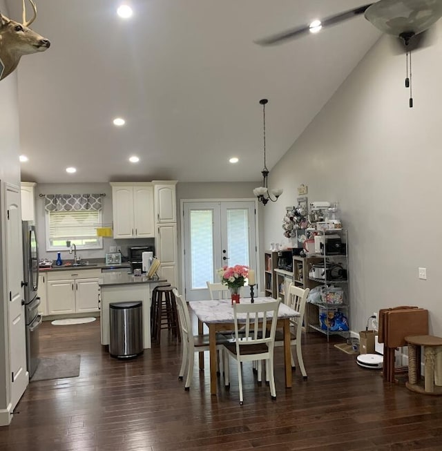 dining space with french doors, a ceiling fan, dark wood-style floors, and recessed lighting