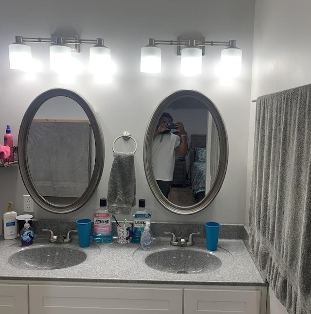 bathroom featuring double vanity and a sink