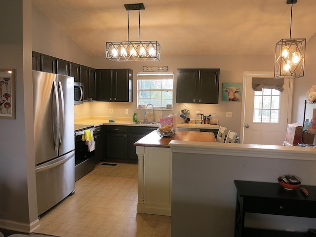5534 Carlyle Ave, Russellville, TN 37860 - kitchen with appliances with stainless steel finishes, a sink, light countertops, and pendant lighting