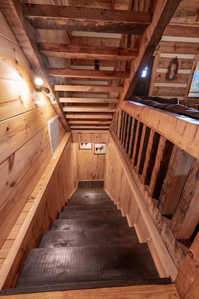 stairway with wood walls