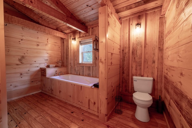 bathroom featuring wood ceiling, wooden walls, lofted ceiling with beams, hardwood / wood-style floors, and toilet