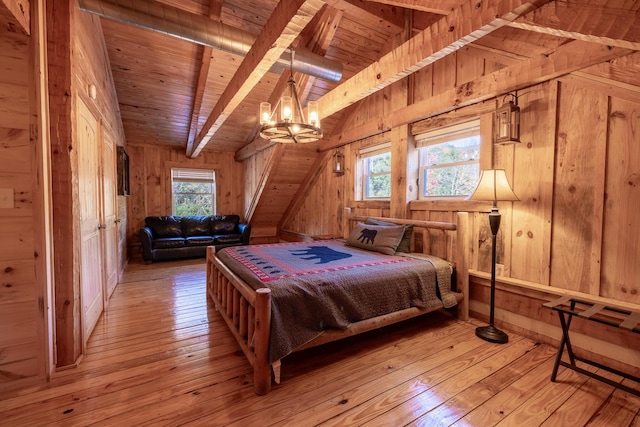 bedroom featuring light hardwood / wood-style floors, wood walls, wooden ceiling, and a chandelier