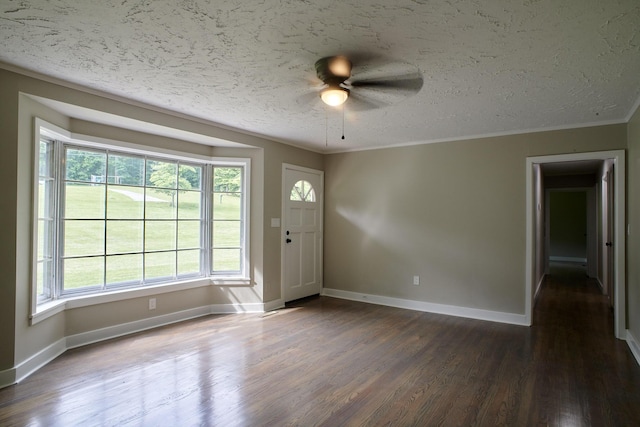 entrance foyer with a textured ceiling, dark wood-type flooring, ceiling fan, and a healthy amount of sunlight