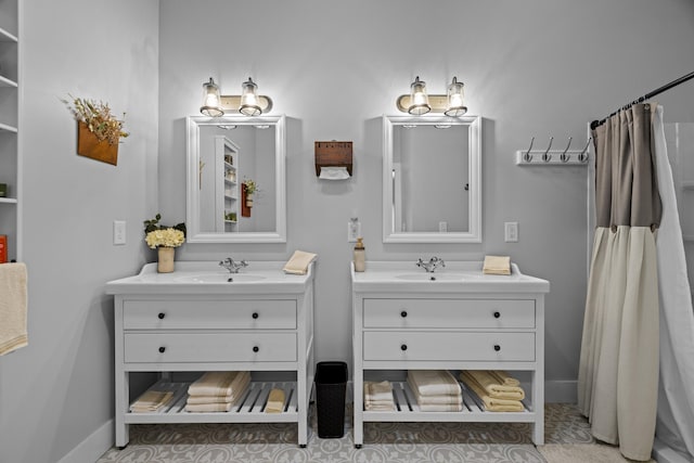 2545 Amanda Ln, Sevierville, TN 37876 - bathroom with two vanities, baseboards, and a shower with curtain