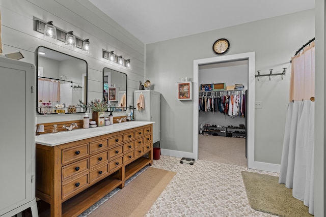 2545 Amanda Ln, Sevierville, TN 37876 - full bathroom with double vanity, a shower with shower curtain, baseboards, and a walk in closet