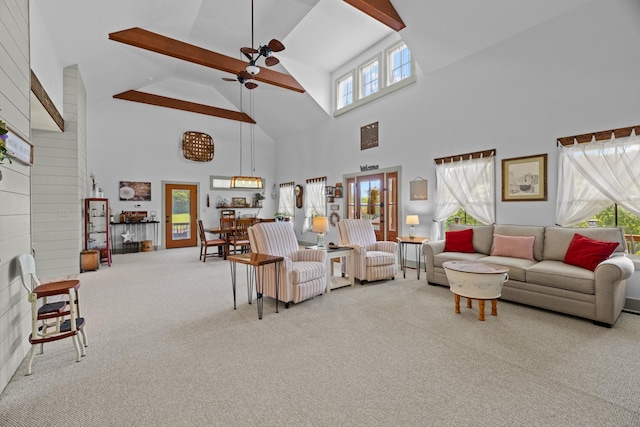2545 Amanda Ln, Sevierville, TN 37876 - living area with high vaulted ceiling, carpet, a ceiling fan, and beam ceiling