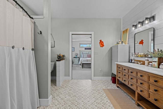 2545 Amanda Ln, Sevierville, TN 37876 - bathroom featuring toilet, vanity, ensuite bathroom, baseboards, and a shower with shower curtain