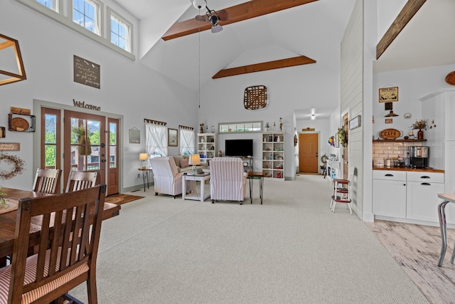 2545 Amanda Ln, Sevierville, TN 37876 - living area with high vaulted ceiling, beam ceiling, light carpet, a ceiling fan, and baseboards