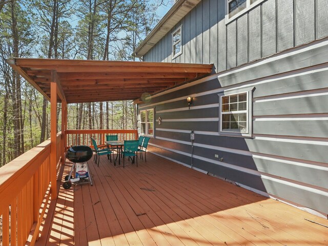 wooden deck with outdoor dining space