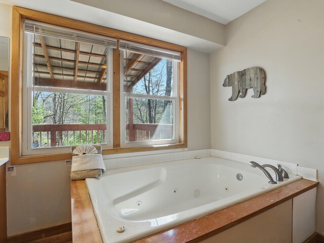full bath featuring a tub with jets