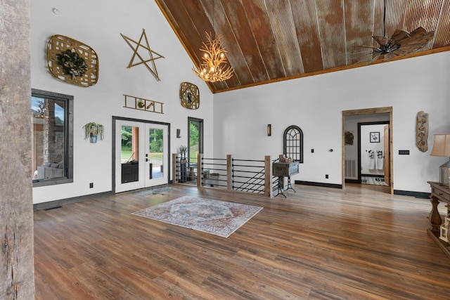 entryway featuring french doors, dark hardwood / wood-style flooring, high vaulted ceiling, wood ceiling, and ceiling fan with notable chandelier