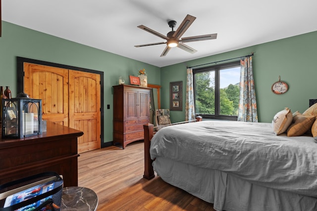 bedroom featuring ceiling fan and light hardwood / wood-style flooring