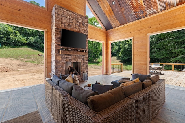 view of patio featuring an outdoor living space with a fireplace