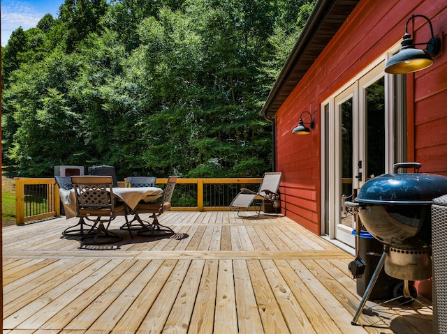 wooden terrace featuring grilling area