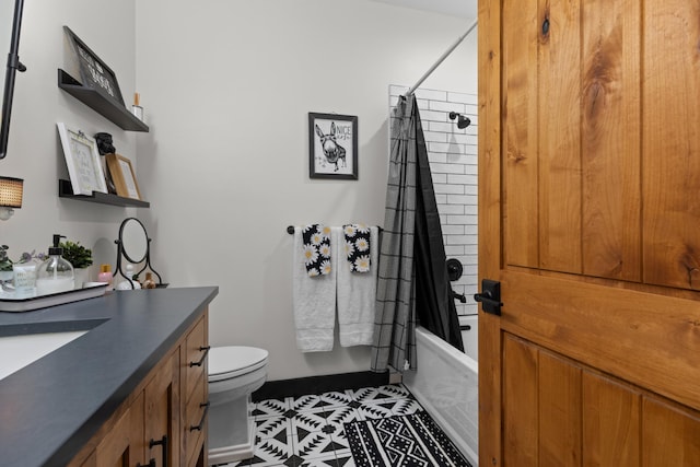 full bathroom with toilet, vanity, tile patterned floors, and shower / bathtub combination with curtain