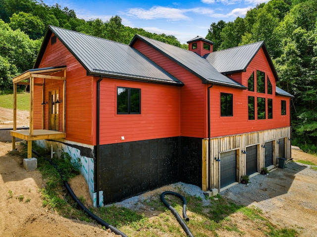 view of side of property with a garage