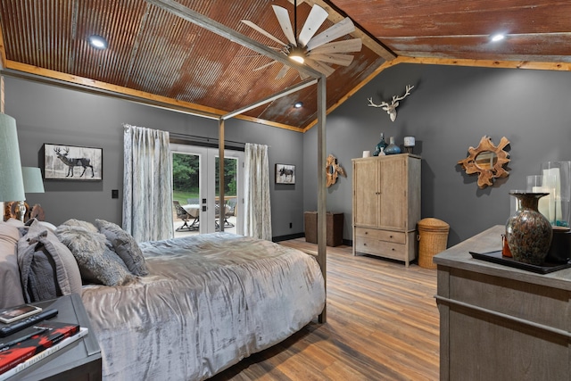 bedroom with access to exterior, ceiling fan, french doors, hardwood / wood-style floors, and wood ceiling