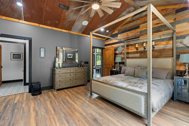 bedroom featuring wood ceiling, ceiling fan, wood-type flooring, and high vaulted ceiling