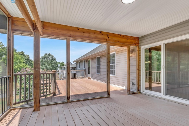 unfurnished sunroom featuring a wealth of natural light