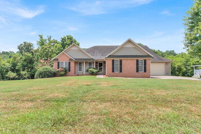 view of front of property featuring a front yard, concrete driveway, and brick siding