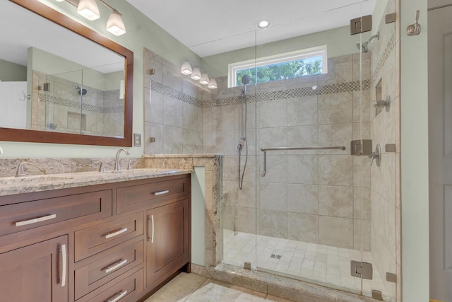 bathroom featuring vanity and a stall shower