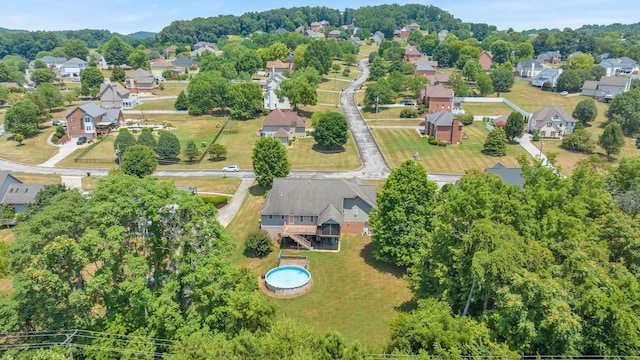 birds eye view of property with a residential view