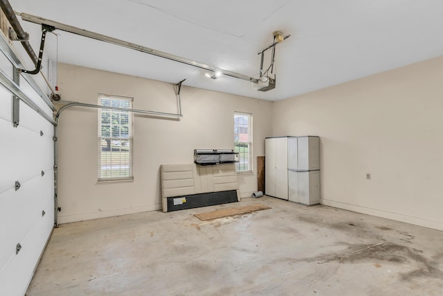 garage featuring baseboards and a garage door opener