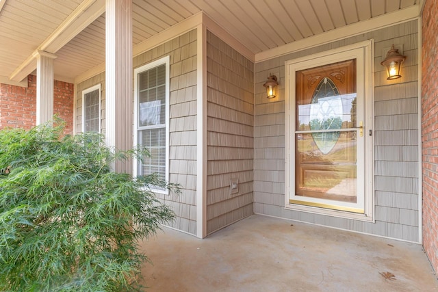 property entrance with covered porch