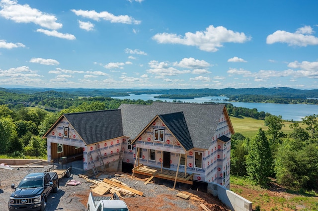 164 Logans Blf, Bean Station, TN 37708 - view of front of home featuring roof with shingles, a water view, and a forest view
