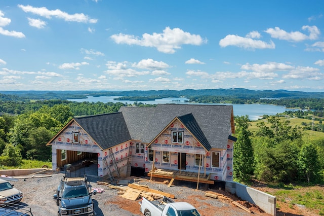 164 Logans Blf, Bean Station, TN 37708 - rear view of house featuring a shingled roof, a water view, and a view of trees