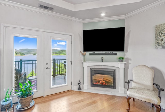 314 Sandpiper Ln, Bean Station, TN 37708 - living area with wood finished floors, a glass covered fireplace, and crown molding