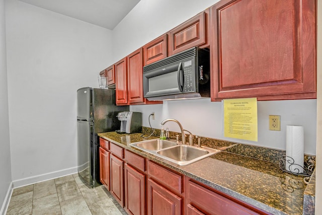 314 Sandpiper Ln, Bean Station, TN 37708 - kitchen with black microwave, a sink, baseboards, and reddish brown cabinets